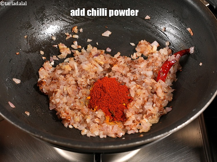 Step 30 – Add &frac12; tsp <a href="https://www.tarladalal.com/glossary-chilli-powder-red-chilli-powder-339i">chilli powder</a>.