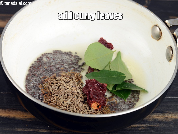 Step 31 – Add 6 to 7 curry leaves.