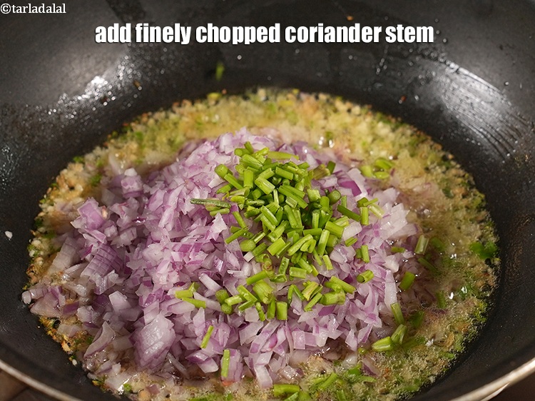 Step 30 – Add 1 tbsp finely <a href="https://www.tarladalal.com/glossary-chopped-coriander-783i">chopped coriander (dhania)</a> stem.
