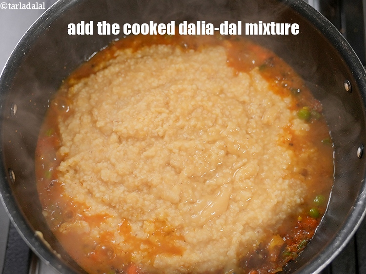 Step 30 – Add the cooked dalia-dal mixture.