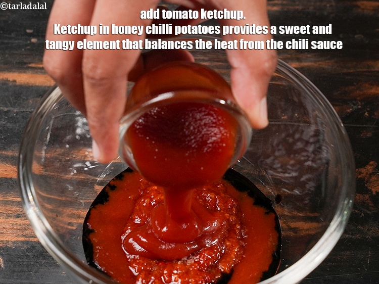 Step 29 – Add 1&frac12; tbsp <a href="https://www.tarladalal.com/glossary-tomato-ketchup-tomato-sauce-181i">tomato ketchup</a>. Ketchup in honey chilli potatoes provides a sweet and …