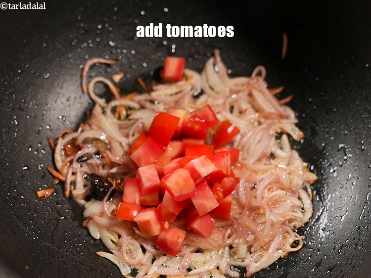 Step 31 – Add &frac12; cup <a href="https://www.tarladalal.com/glossary-chopped-tomatoes-779i">chopped tomatoes</a>.