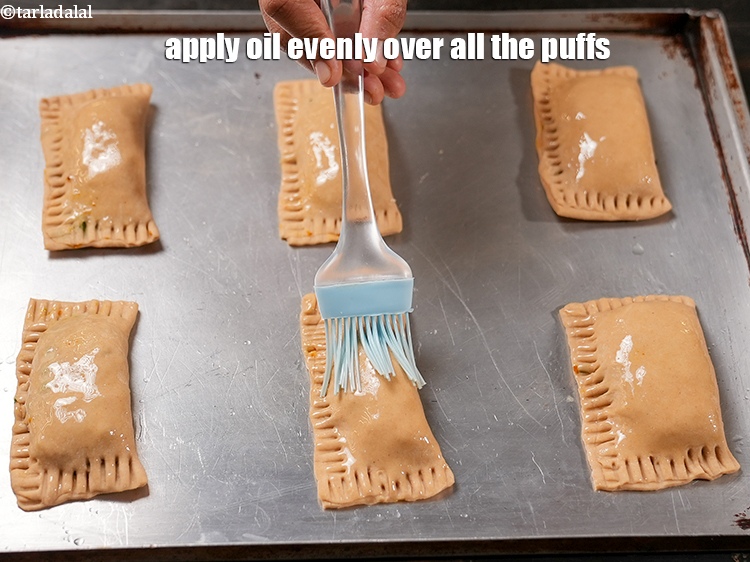 Step 30 – Apply 1 tsp oil evenly over all the puffs.