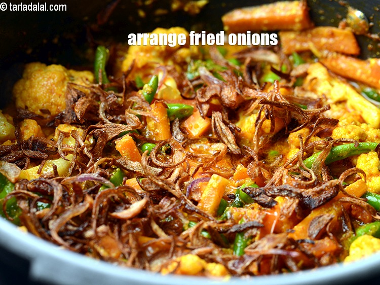 Step 30 – Now arrange <a href="https://www.tarladalal.com/glossary-fried-onions-924i">fried onions</a>.
