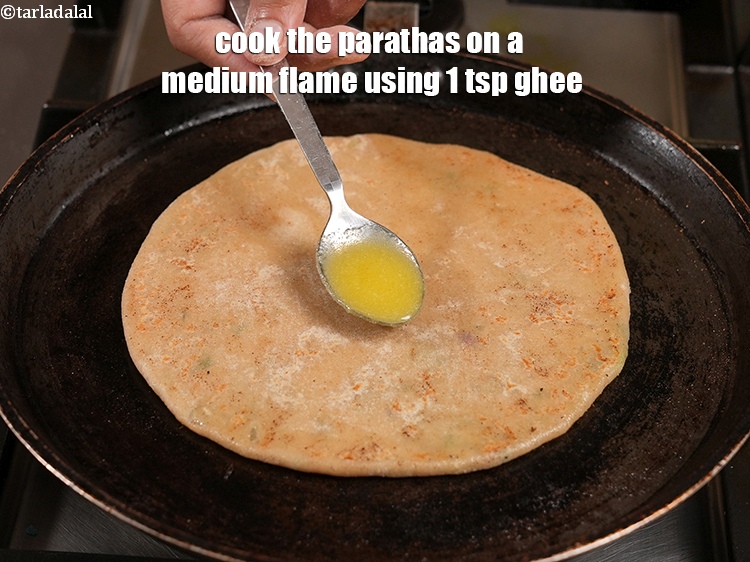 Step 30 – Cook the parathas on a medium flame using 1 tsp ghee.