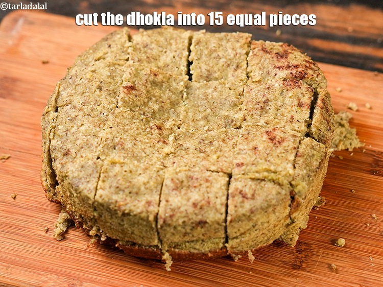 Step 37 – Demould it. Cut the dhokla&nbsp;into 15 equal pieces.