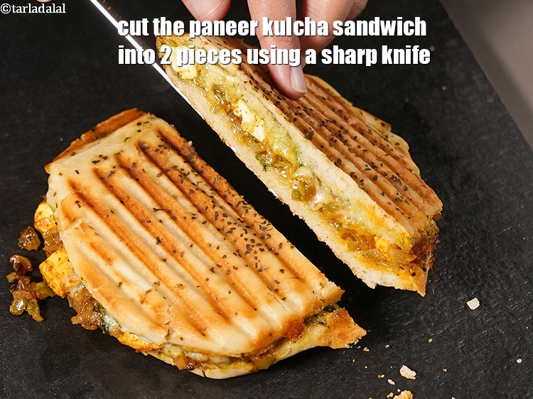 Step 30 – Cut the paneer kulcha sandwich into 2 pieces using a sharp knife.