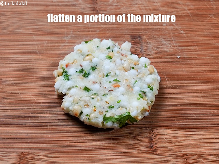Step 30 – Flatten a portion of the sabudana-potato mixture into a 75 mm. (3") diameter circle.