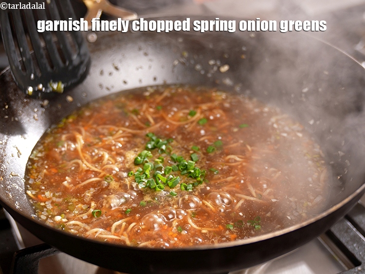 Step 30 – Garnish with 2 tbsp finely <a href="https://www.tarladalal.com/glossary-chopped-spring-onion-greens-1030i">chopped spring onion greens</a>.