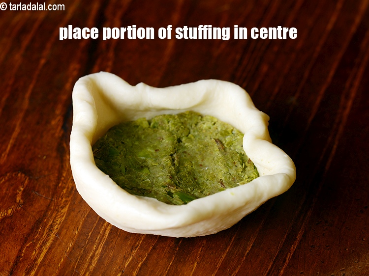 Step 30 – Place a portion of the stuffing in the centre of the circle.