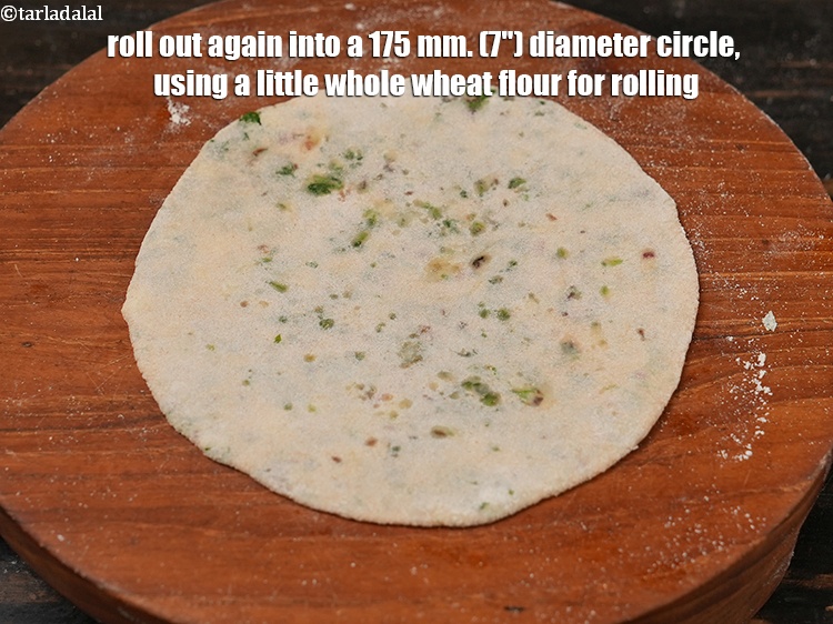 Step 31 – Roll out again into a 175 mm. (7") diameter circle, using a little whole wheat …