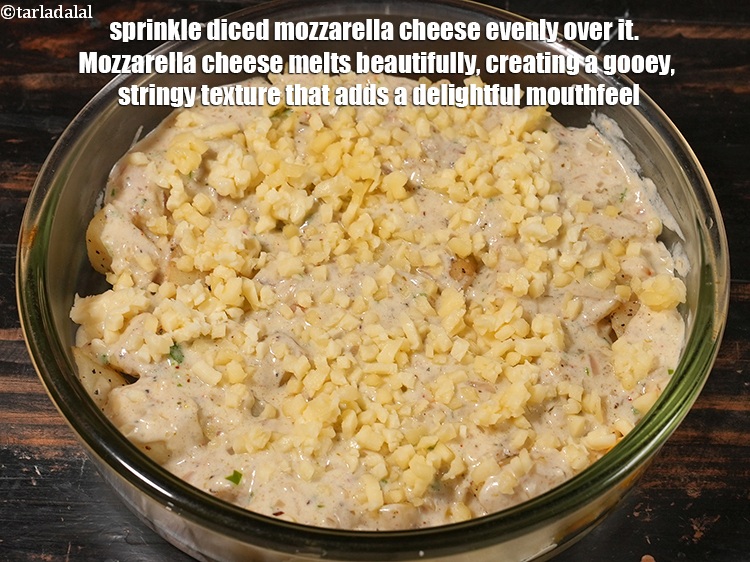 Step 30 – Sprinkle &frac14; cup <a href="https://www.tarladalal.com/glossary-diced-mozzarella-cheese-2805i">diced mozzarella cheese</a> evenly over it. &nbsp;Mozzarella cheese melts beautifully, creating …