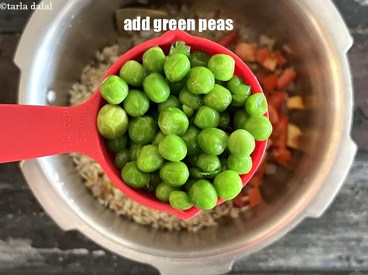 Step 30 – Add&nbsp;<meta charset="UTF-8" />1/4 cup&nbsp;<a href="glossary-green-peas-matar-hare-matar-vatana-180i">green peas</a>.