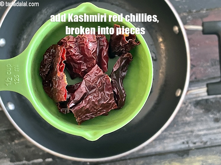 Step 33 – Add&nbsp;<meta charset="UTF-8" />2&nbsp;<a href="glossary-whole-dry-kashmiri-red-chillies-kashmiri-mirch-kashmiri-lal-mirch-332i">whole dry kashmiri red chillies</a>&nbsp;, broken into pieces.