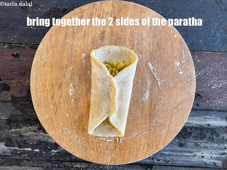 Step 46 – Bring together the 2 sides of the paratha.