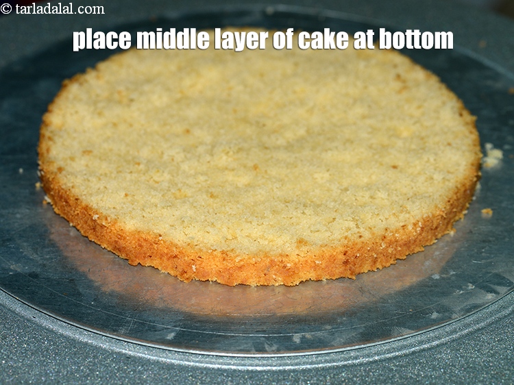Step 32 – Place the middle layer of the cake at the bottom.