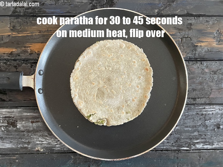 Step 31 – <meta charset="UTF-8" /> Cook paratha for 30 to 45 seconds on a medium flame and …