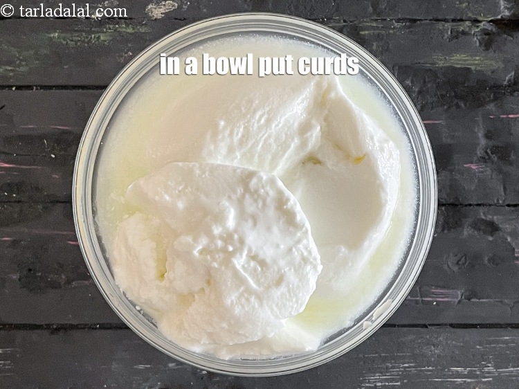 Step 30 – In a bowl put&nbsp;<meta charset="UTF-8" />1 1/4 cups&nbsp;<a href="glossary-low-fat-curds-low-cal-dahi-low-calorie-curd-low-fat-yogurt-1107i">low-fat curds (dahi)</a>.