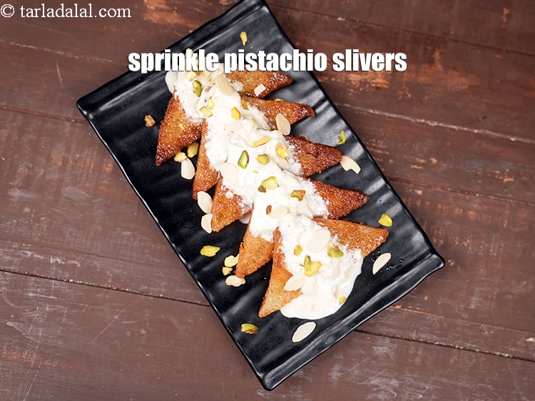 Step 31 – Sprinkle pistachio slivers.
