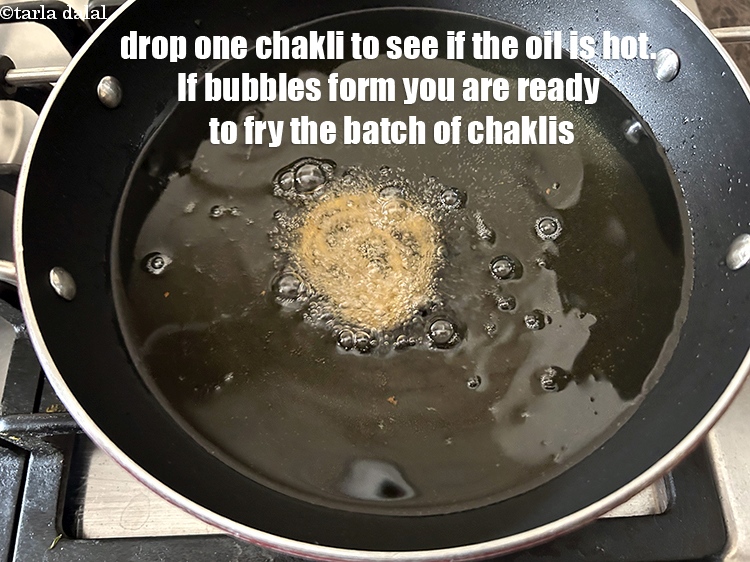 Step 31 – Drop one chakli in to see if the oil is hot. Bubbles will form if …