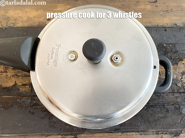 Step 50 – Pressure cook for 3 whistles.&nbsp;Allow the steam to escape before opening the lid.