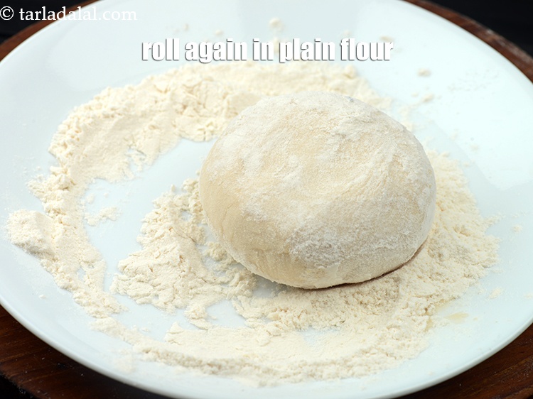 Step 32 – Roll again in plain flour.&nbsp;