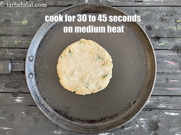 Step 32 – <meta charset="UTF-8" />Cook paratha for 30 to 45 seconds on a medium flame.&nbsp;&nbsp;