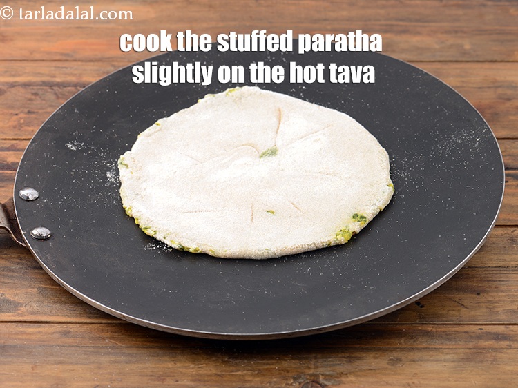 Step 31 – Place the stuffed<strong>&nbsp;</strong>paratha&nbsp;gently on the hot tava. Cook one side of the paratha till you …