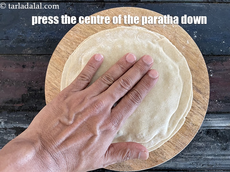 Step 32 – Press the centre of the stuffed paratha down also.