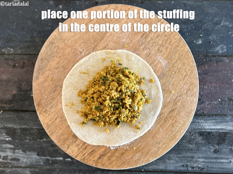 Step 35 – Place one portion of the filling in the center of the circle.