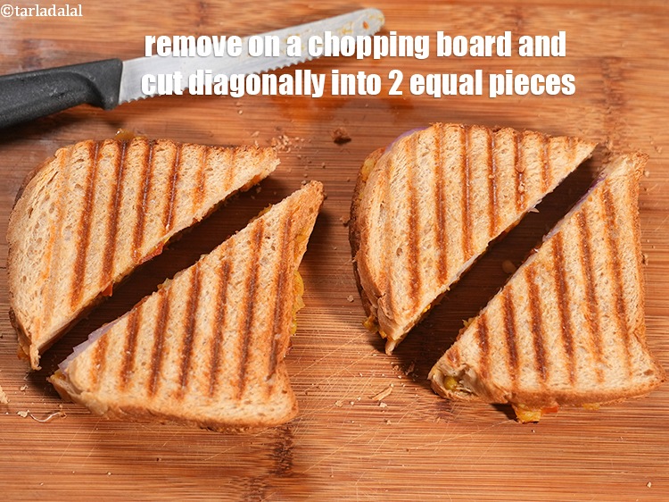 स्टेप 32 – चॉपिंग बोर्ड पर निकालें और तिरछे 2 बराबर टुकड़ों में …