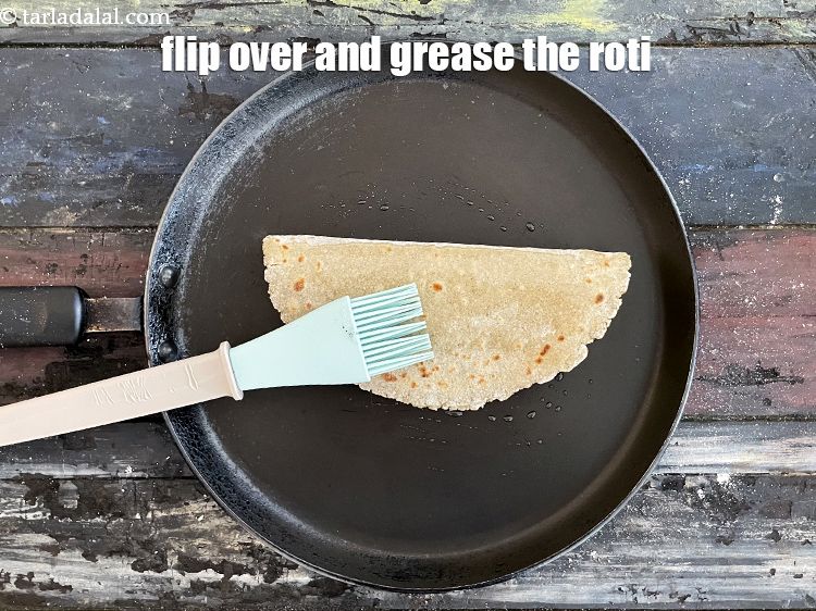 Step 33 – Flip over and grease the roti.