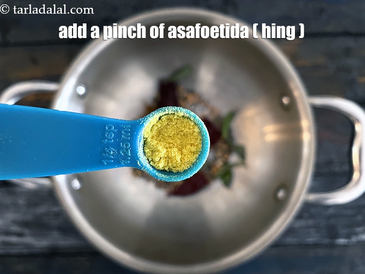 Step 30 – Add&nbsp;<meta charset="UTF-8" />a pinch of&nbsp;<a href="glossary-asafoetida-hing-113i">asafoetida (hing)</a>.