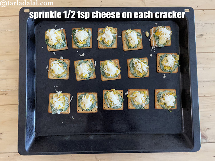 Step 44 – Sprinkle &frac12; tsp of cheese one each cream cracker.