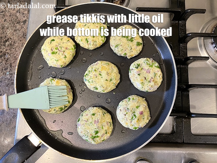 Step 31 – Grease the top of the tikkis with little oil while the bottom cooks.