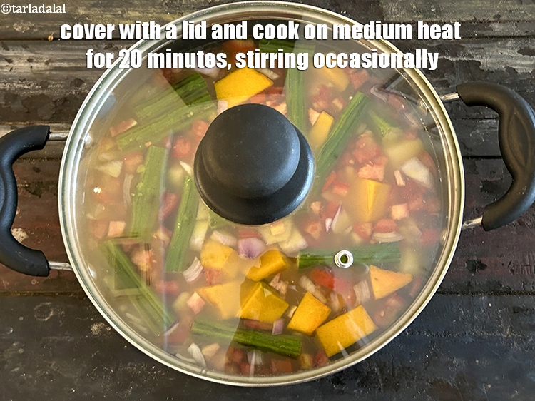 Step 32 – <p>Cover with a lid and cook on a medium flame for <strong>20&nbsp;minutes</strong>, while stirring occasionally.</p>
