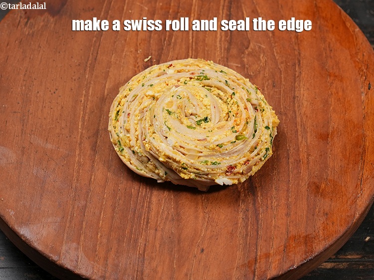 Step 31 – Make a swiss roll and seal the edge.