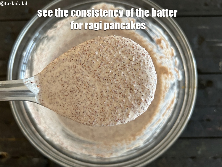 Step 31 – See the consistency of the final batter for ragi pancakes.
