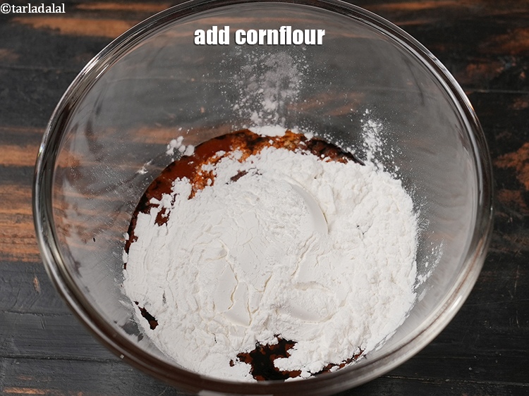 Step 30 – Add 2 tbsp <a href="https://www.tarladalal.com/glossary-cornflour-cornstarch-maize-starch-corn-flour-112i">cornflour</a>.