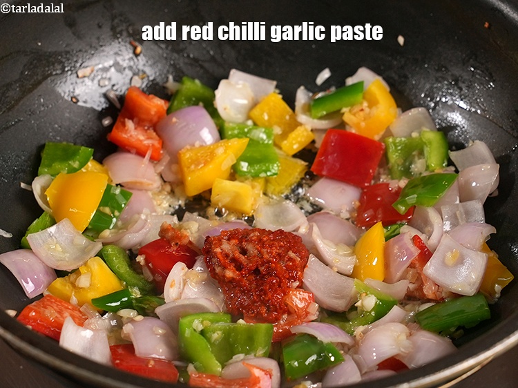 Step 31 – Add &frac12; tbsp <a href="https://www.tarladalal.com/glossary-red-chilli-garlic-paste-laal-mirchi-lehsun-ki-paste-602i">red chilli garlic paste</a>.