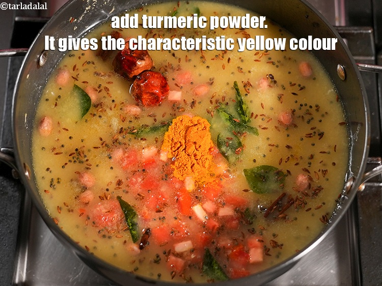Step 31 – Add &frac12; tsp <a href="https://www.tarladalal.com/glossary-turmeric-powder-haldi-645i">turmeric powder (haldi)</a>. It gives the characteristic yellow colour.