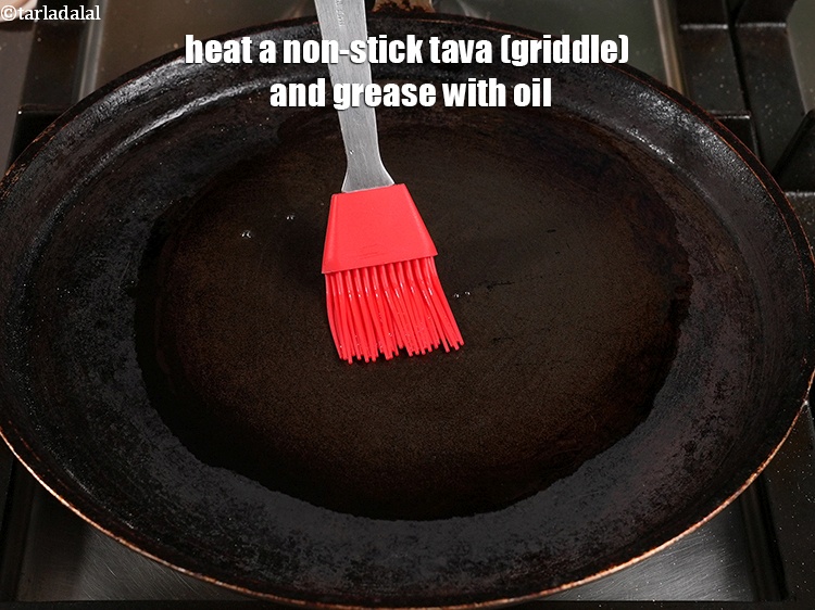 Step 39 – Heat a non-stick tava (griddle) and grease with oil.