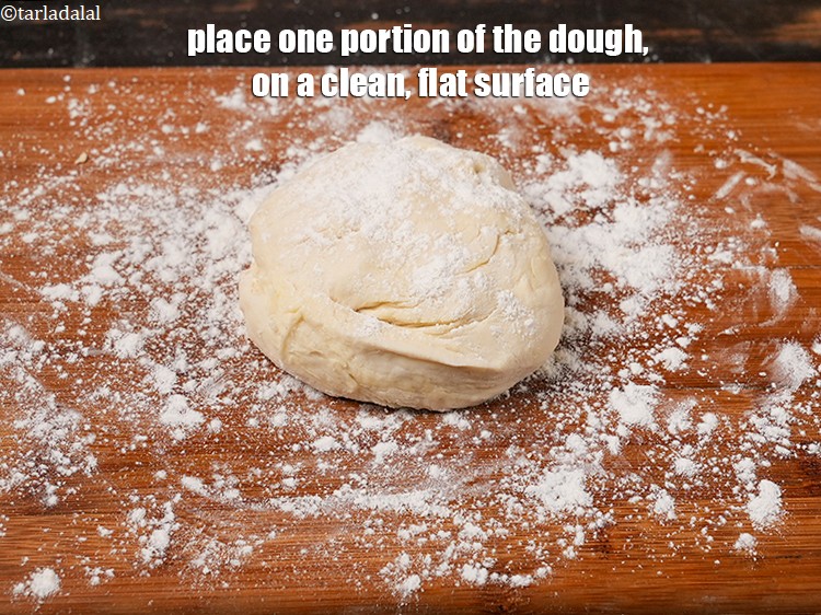 Step 32 – Place one portion of the dough, on a clean, flat surface.