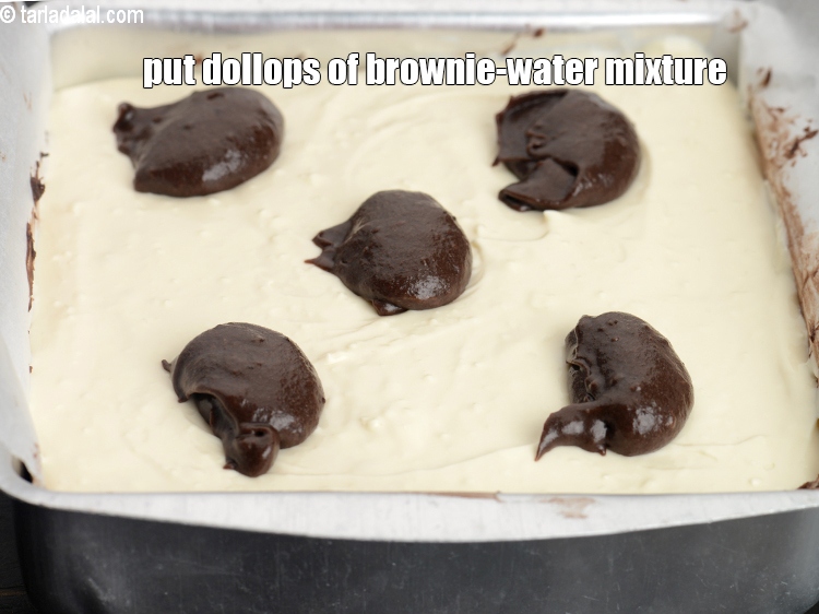 Step 31 – Put the dollops of brownie-water mixture over the cream cheese mixture.