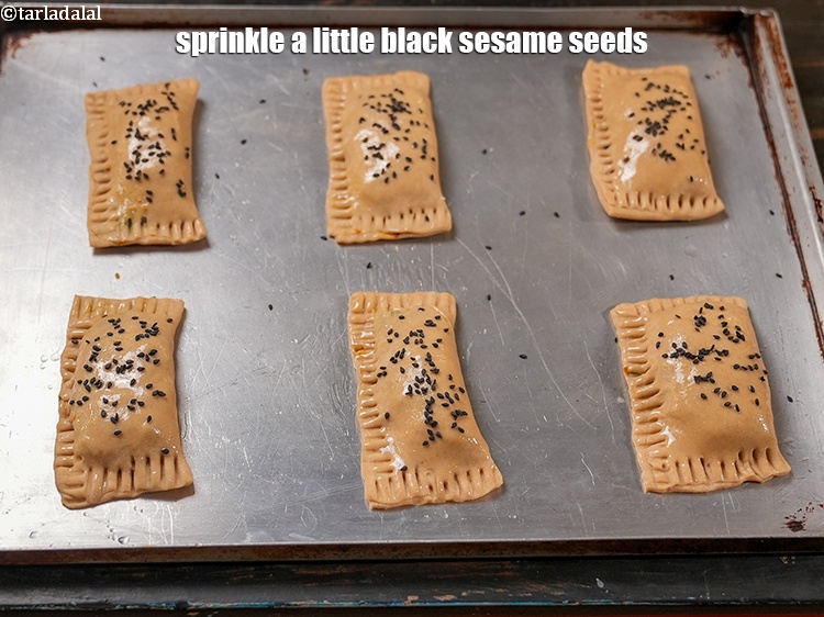 Step 31 – Sprinkle a little <a href="https://www.tarladalal.com/glossary-black-sesame-seeds-kala-til-kale-til-862i">black sesame seeds (kala til)</a>.