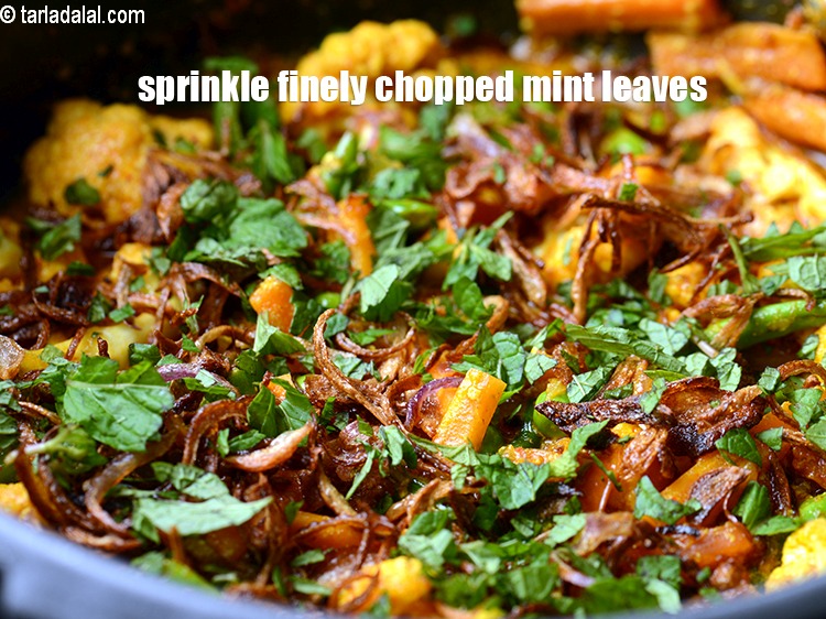 Step 31 – Sprinkle little finely <a href="https://www.tarladalal.com/glossary-chopped-mint-788i">chopped mint leaves (phudina)</a>.