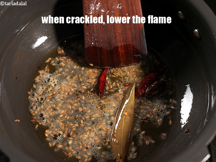 Step 31 – When crackled, lower the flame.