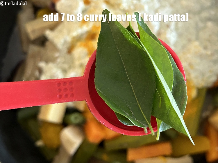 Step 31 – Add&nbsp;<meta charset="UTF-8" />7 to 8&nbsp;<a href="glossary-curry-leaves-kadi-patta-kadipatta-388i">curry leaves (kadi patta)</a>.