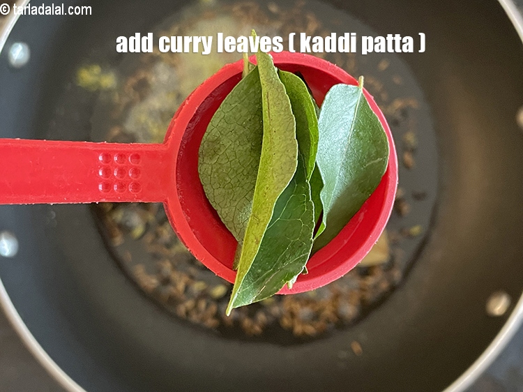 Step 32 – Add&nbsp;<meta charset="UTF-8" />4 to 6&nbsp;<a href="glossary-curry-leaves-kadi-patta-kadipatta-388i">curry leaves (kadi patta)</a>.