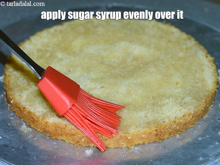 Step 33 – Apply the sugar syrup evenly over the layer using a brush.